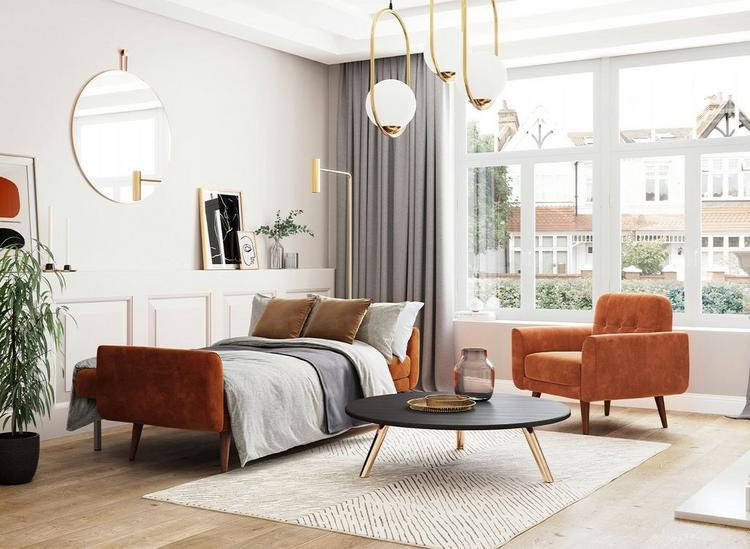 Guest bedroom ideas - Orange velvet clic-clac sofa bed, arranged for sleep, sat alongside a matching chair