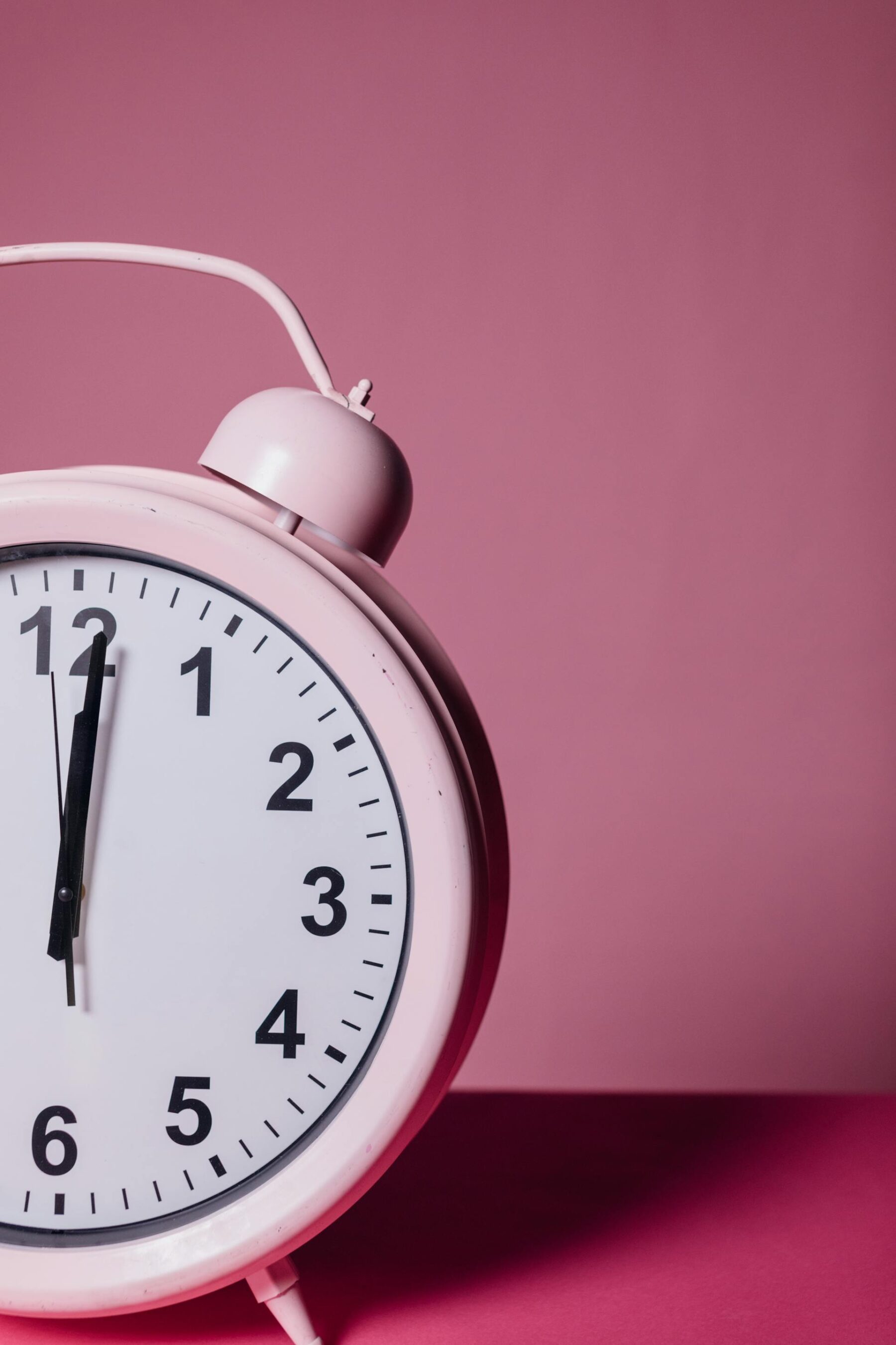 Close-Up Photo of Pink Alarm Clock
