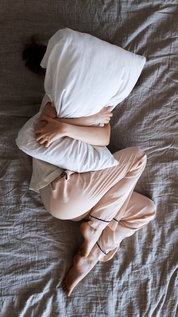 Woman squeezing pillow